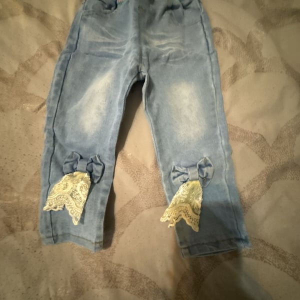 Toddler Girls Light Wash Denim Jeggings with Pink Elastic Waistband and Lace Bow Accents