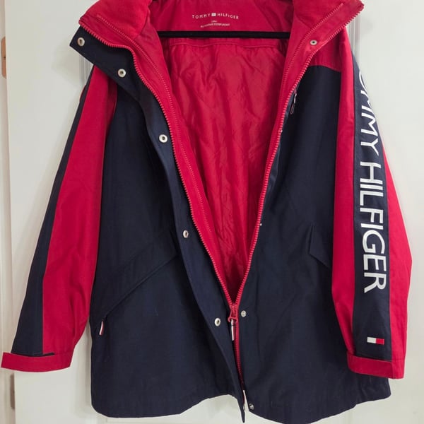 Tommy Hilfiger Women's 3-in-1 All Weather System Jacket in Red and Navy. Adjustable hood and hand cuffs, 2 zipper pockets and 2 zip-up sizes (see pic).