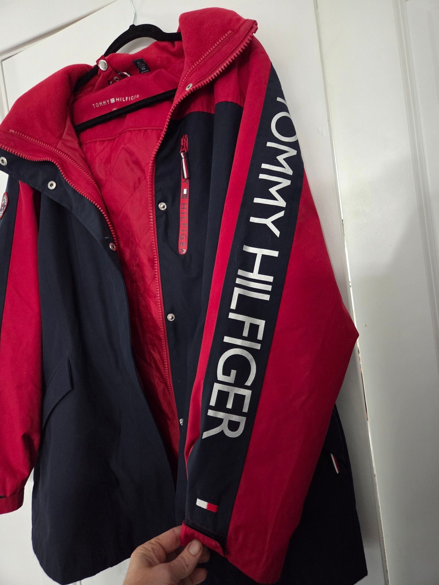 Tommy Hilfiger Women's 3-in-1 All Weather System Jacket in Red and Navy. Adjustable hood and hand cuffs, 2 zipper pockets and 2 zip-up sizes (see pic). 3