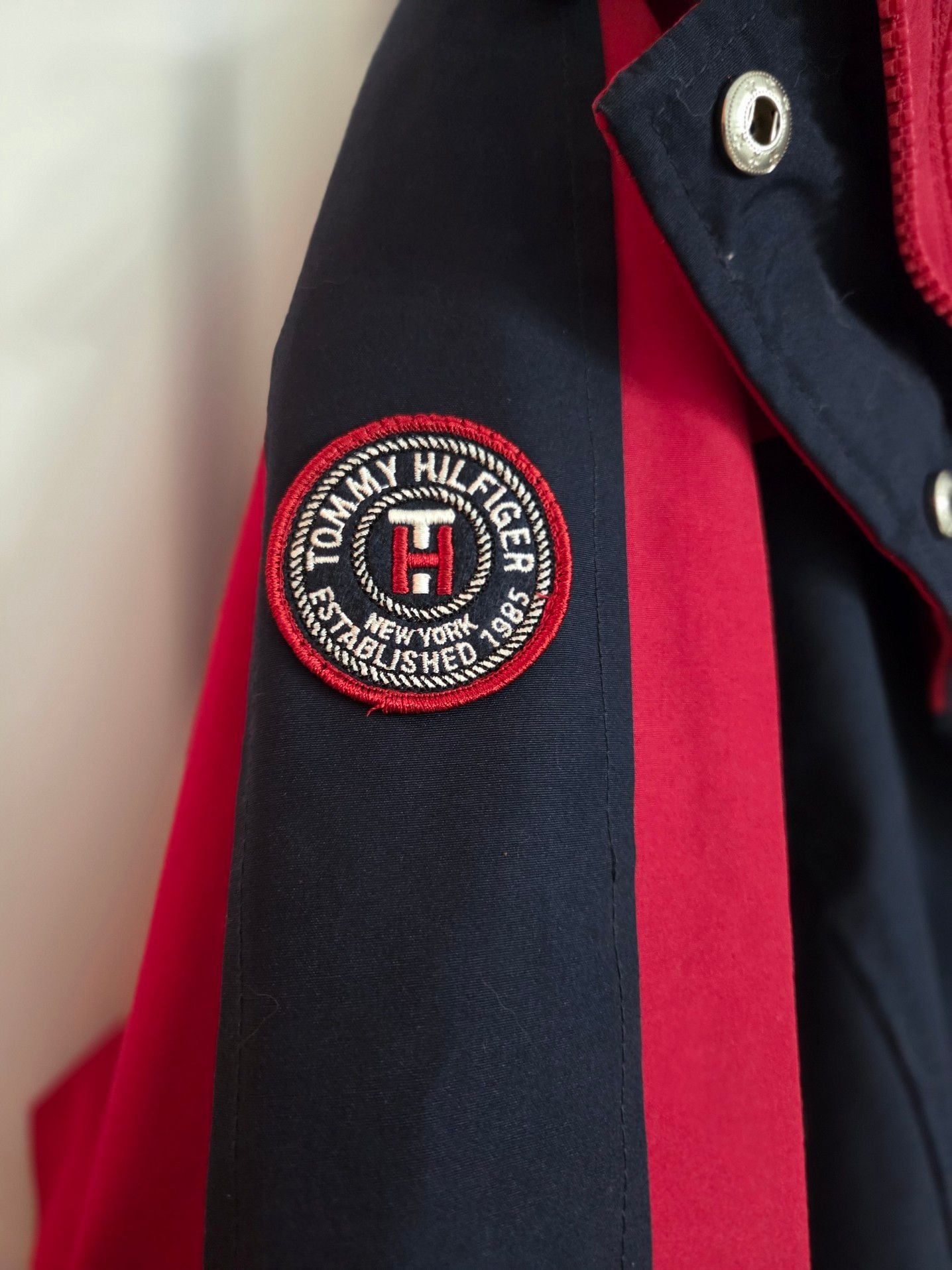 Tommy Hilfiger Women's 3-in-1 All Weather System Jacket in Red and Navy. Adjustable hood and hand cuffs, 2 zipper pockets and 2 zip-up sizes (see pic). 5