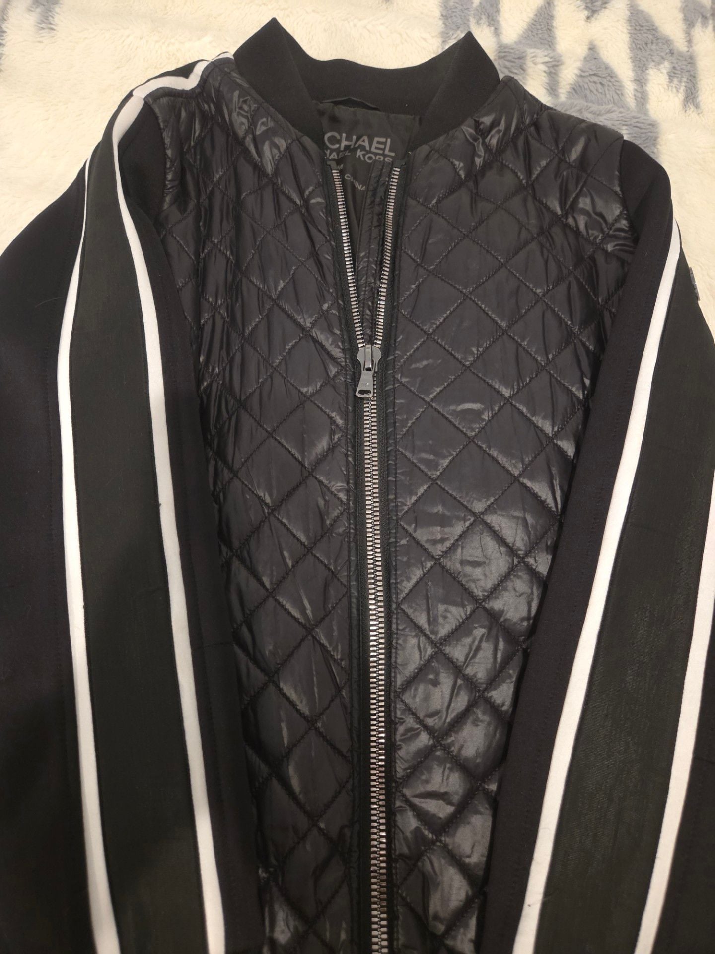 Michael Kors Women's Quilted Bomber Jacket with Contrast Stripe Sleeves.
*Estimated value is $85 on sellraze* 6