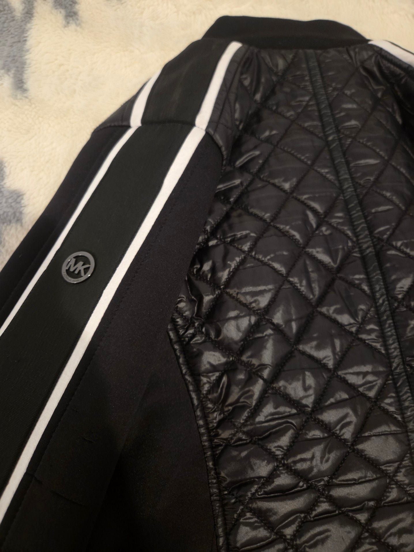 Michael Kors Women's Quilted Bomber Jacket with Contrast Stripe Sleeves.
*Estimated value is $85 on sellraze* 9
