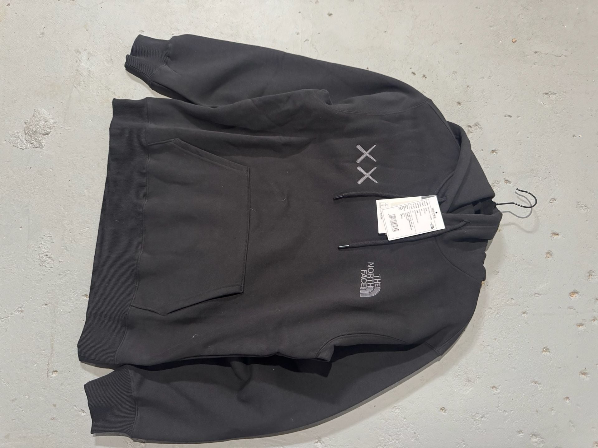 The North Face x KAWS Pullover Hoodie in Black 1