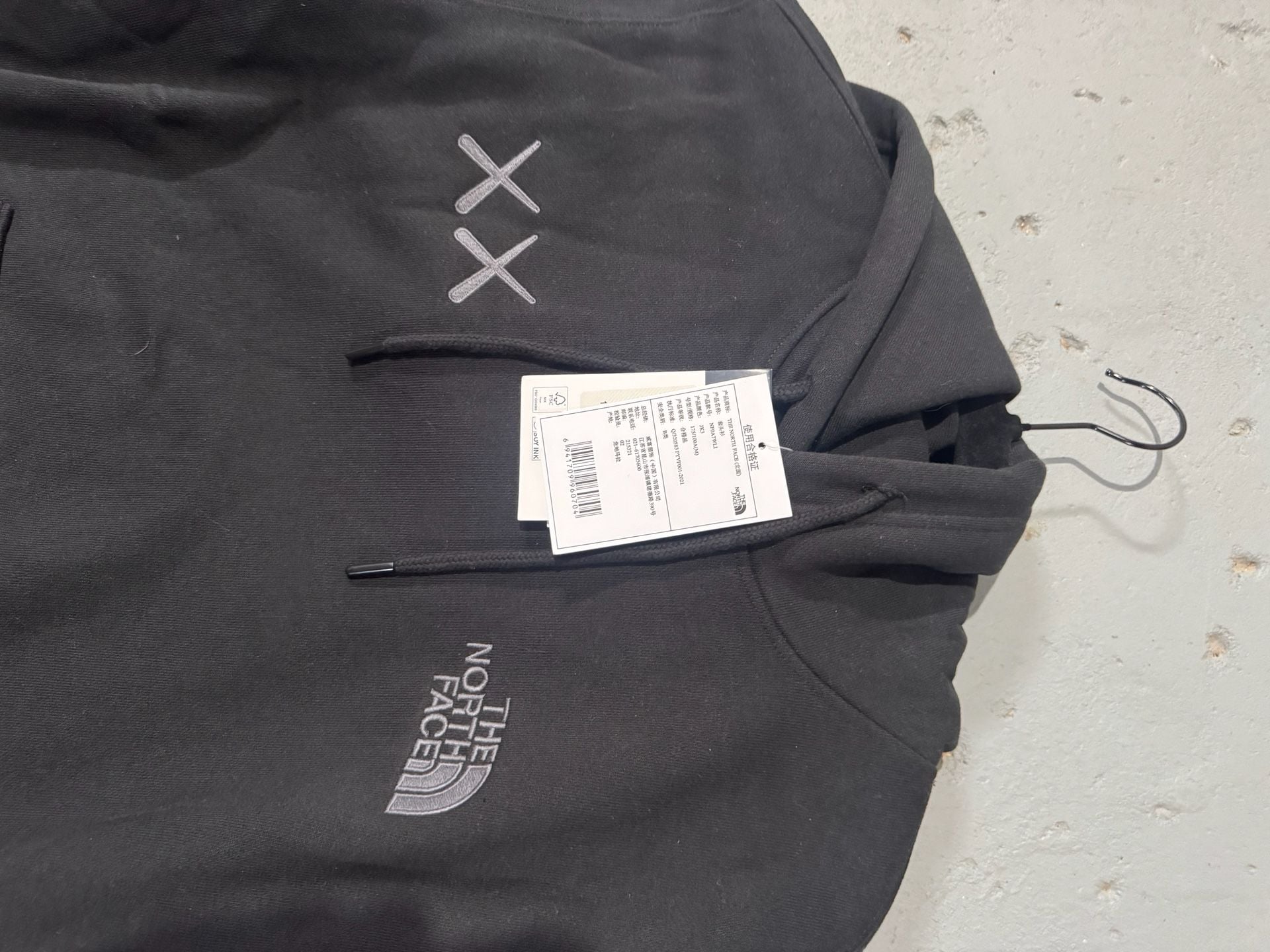 The North Face x KAWS Pullover Hoodie in Black 2