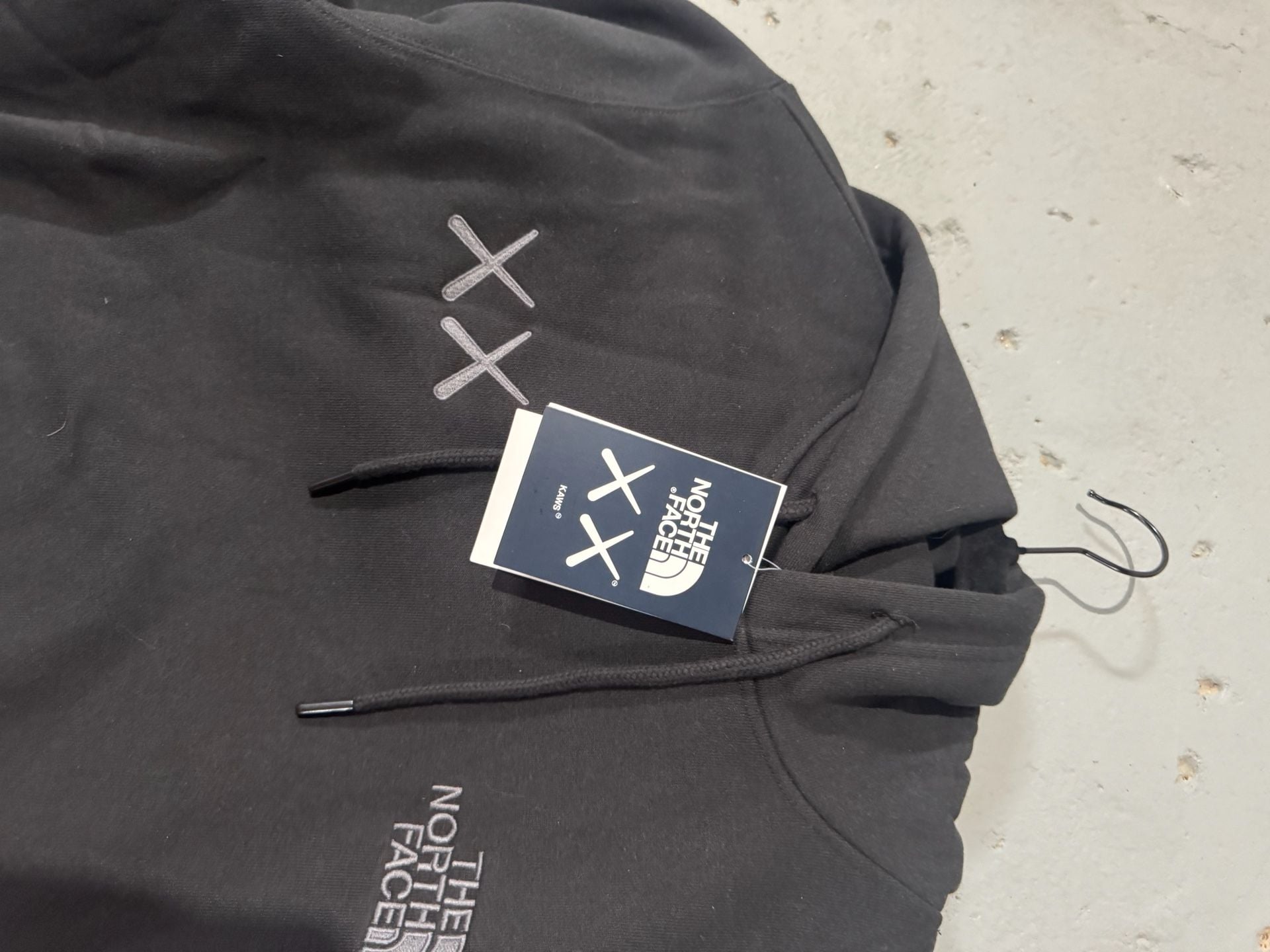 The North Face x KAWS Pullover Hoodie in Black 3