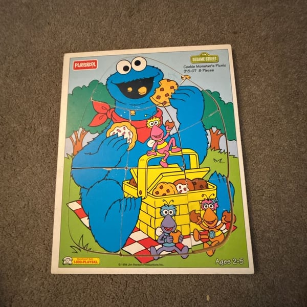 Vintage 1994 Playskool Sesame Street Cookie Monster's Picnic 8-Piece Wooden Puzzle, approximately 11.5 x 9.5 inches.