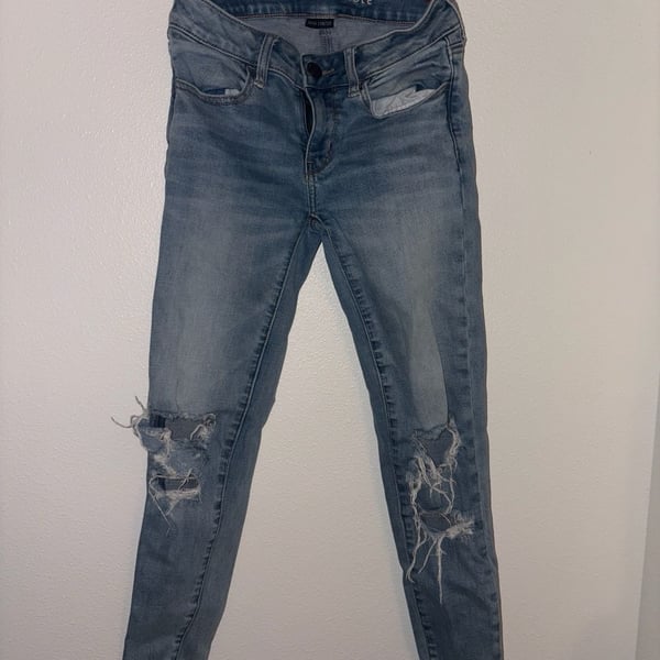 American Eagle Super Stretch Distressed Raw Hem Skinny Jeans
