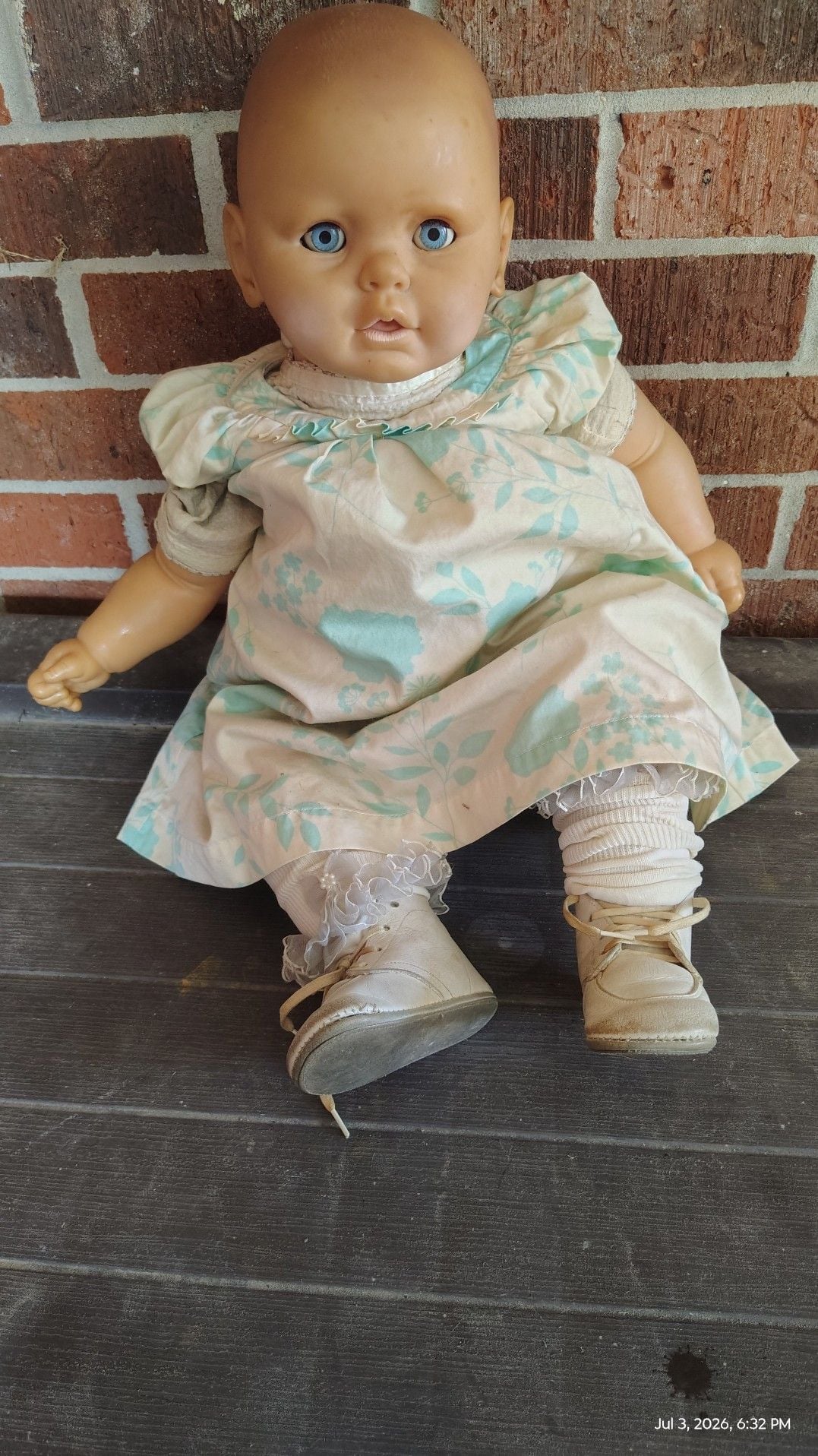 Vintage Vinyl Baby Doll with Blue Sleep Eyes and Floral Dress 1