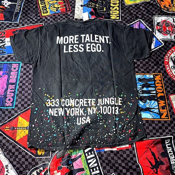 More Talent Less Ego Paint Splatter Graphic T-Shirt