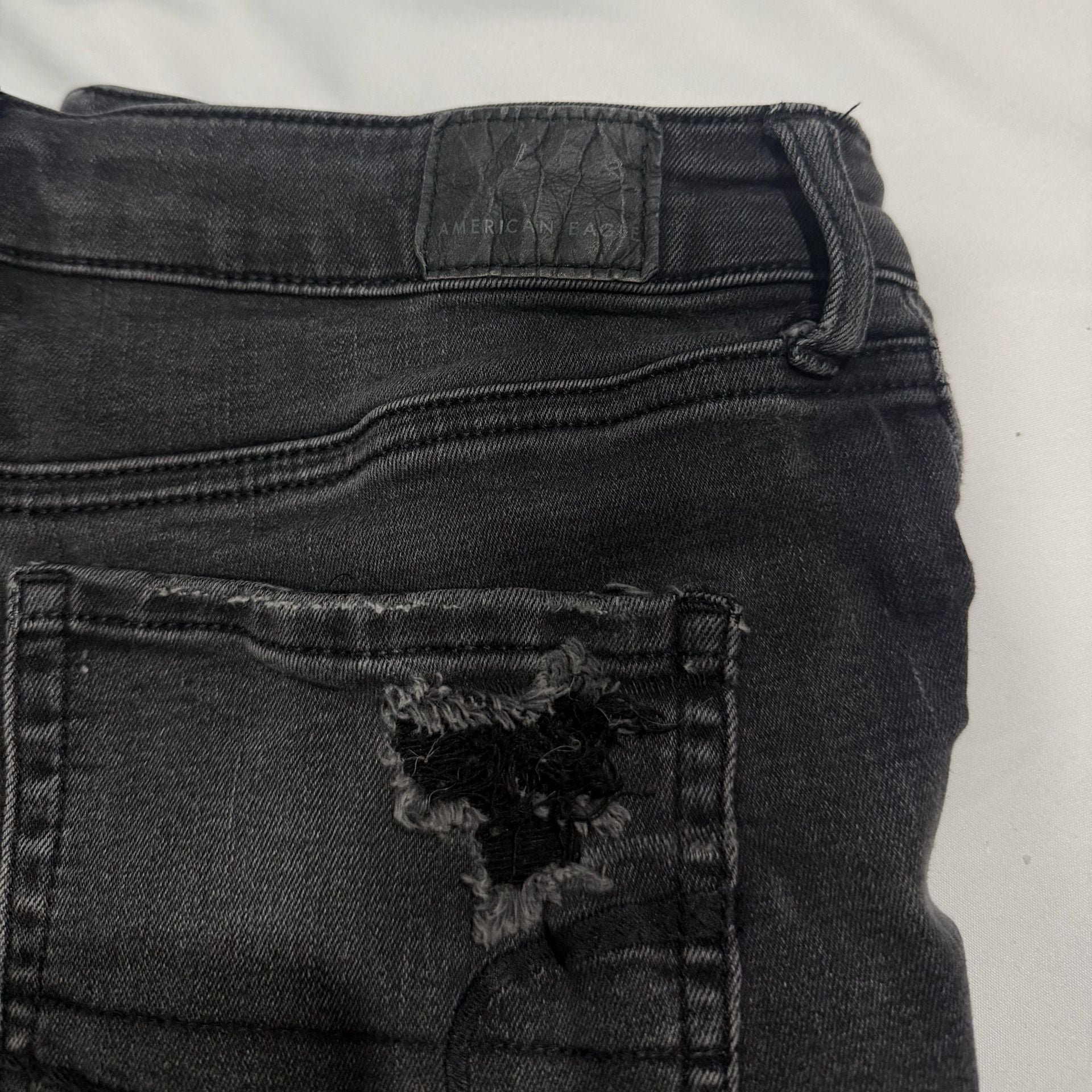 American Eagle Super Hi-Rise Next Level Stretch Black Distressed Button-Fly Shorties 5