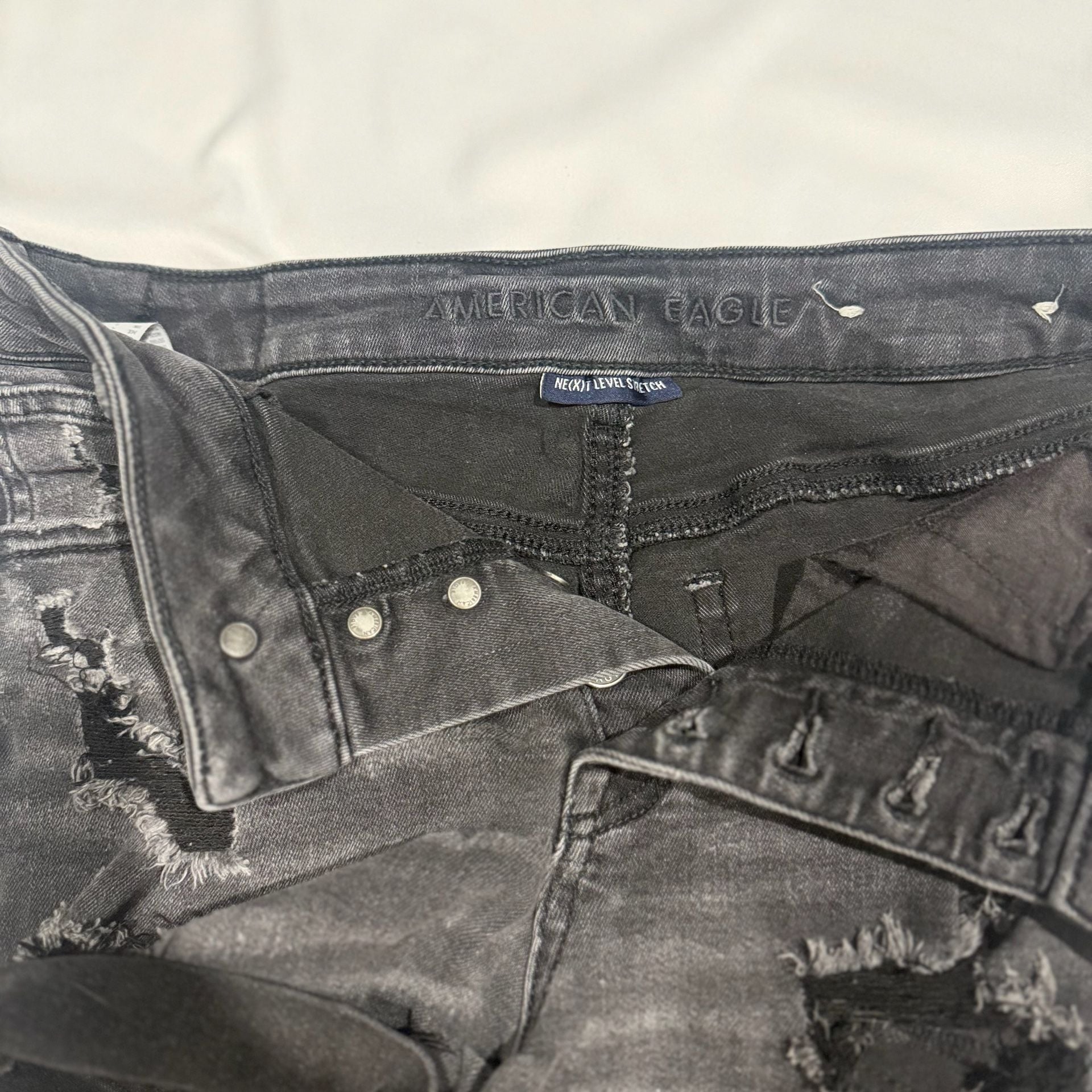 American Eagle Super Hi-Rise Next Level Stretch Black Distressed Button-Fly Shorties 6