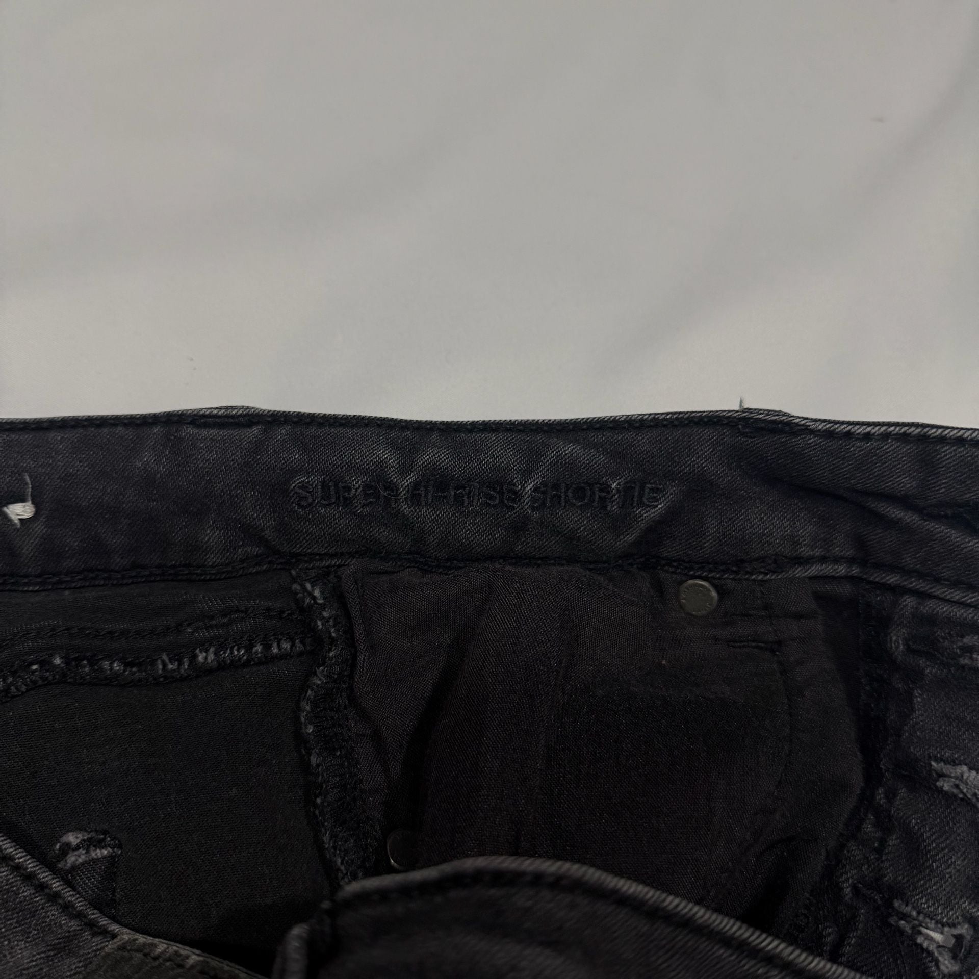American Eagle Super Hi-Rise Next Level Stretch Black Distressed Button-Fly Shorties 7