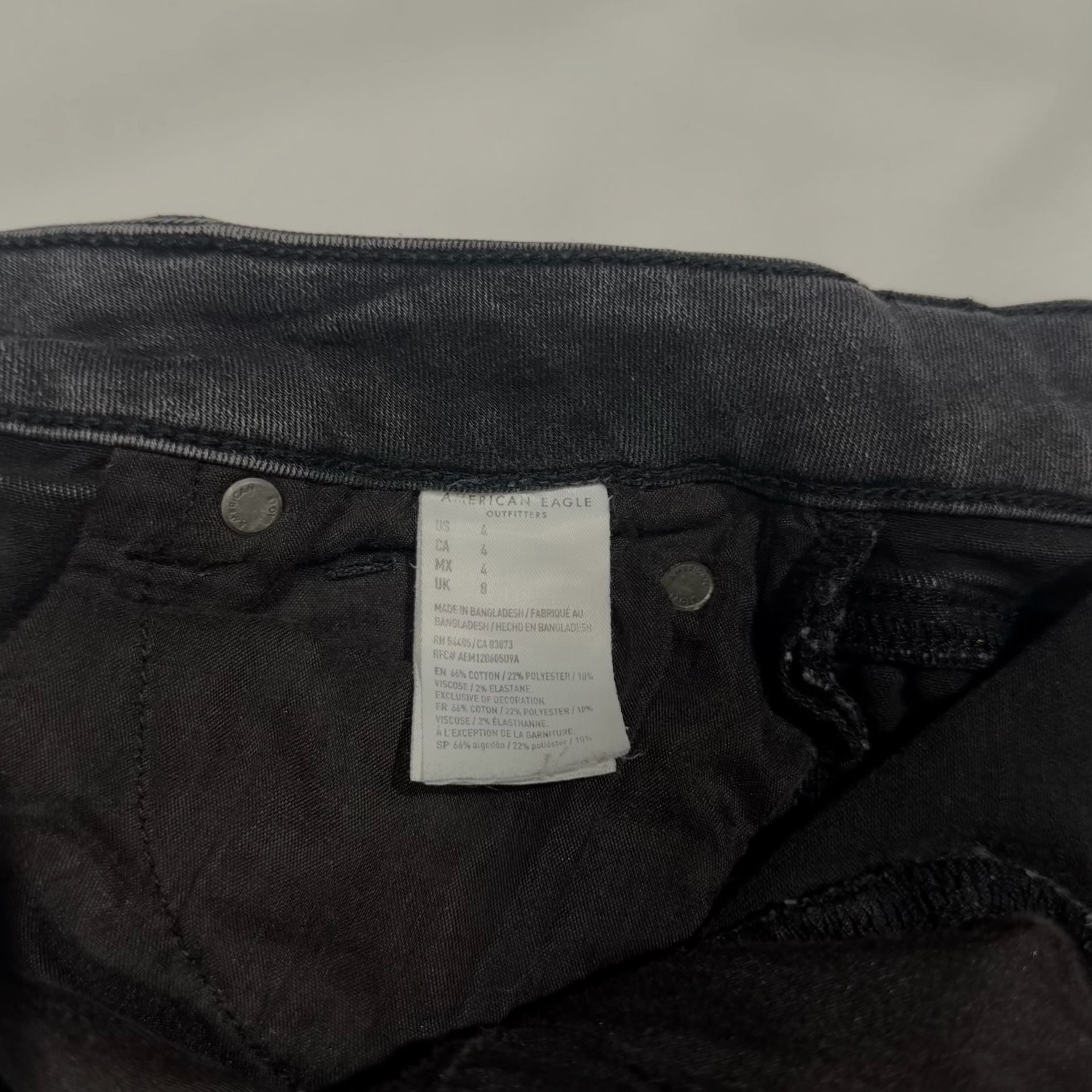 American Eagle Super Hi-Rise Next Level Stretch Black Distressed Button-Fly Shorties 8