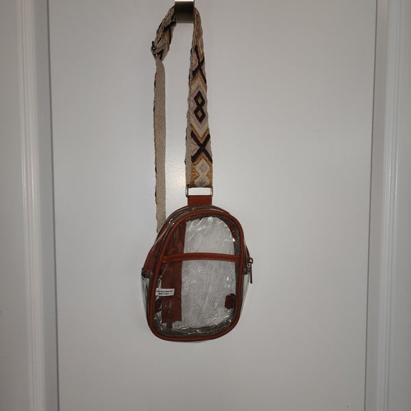 Clear Sling Crossbody Bag with Brown Trim and Patterned Guitar-Style Strap