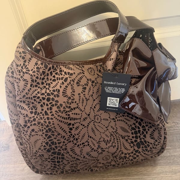 Valentino Garavani Laser-Cut Floral Pattern Brown Leather Handbag with Bow Detail