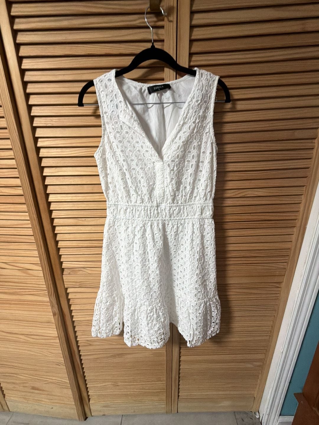 Zesica White Sleeveless V-Neck Eyelet Ruffle Hem Mini Dress 1