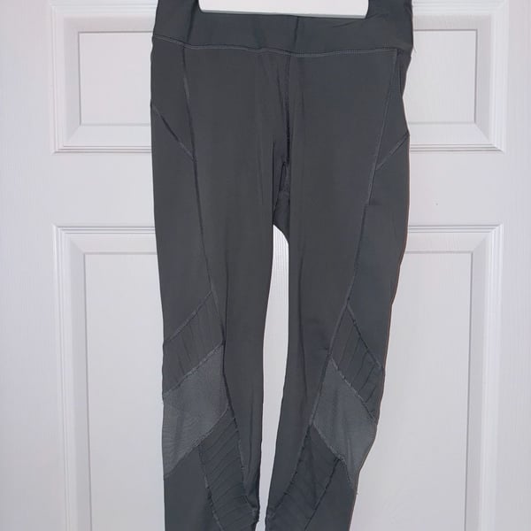 Avia athletic forest green leggings with mesh striping. Size M/L