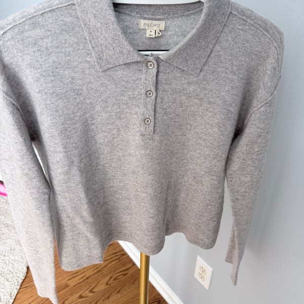 Pilcro 100% cashmere sweater in light grey. Long sleeves, button front with collar. 