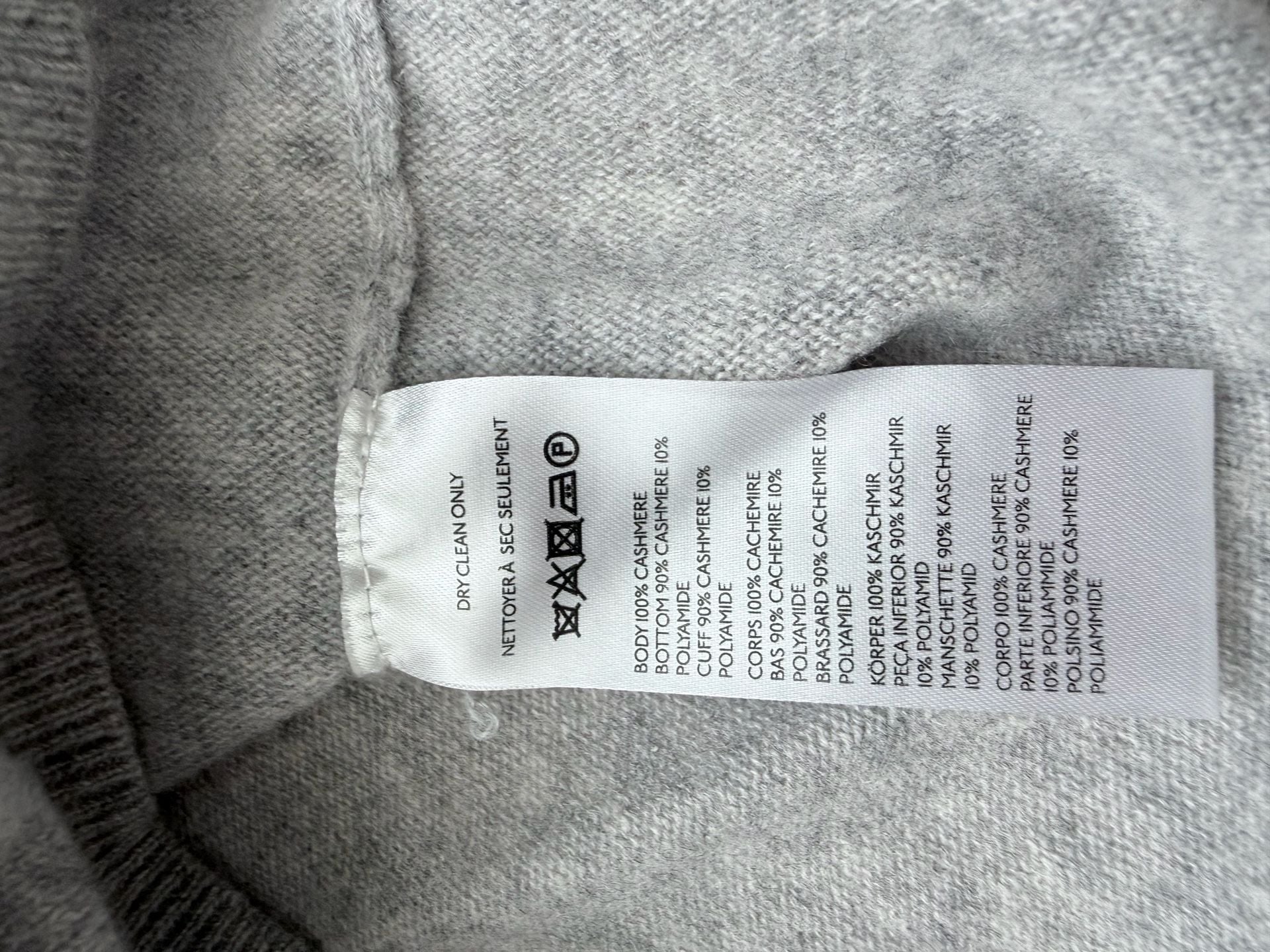 Pilcro 100% cashmere sweater in light grey. Long sleeves, button front with collar.  7