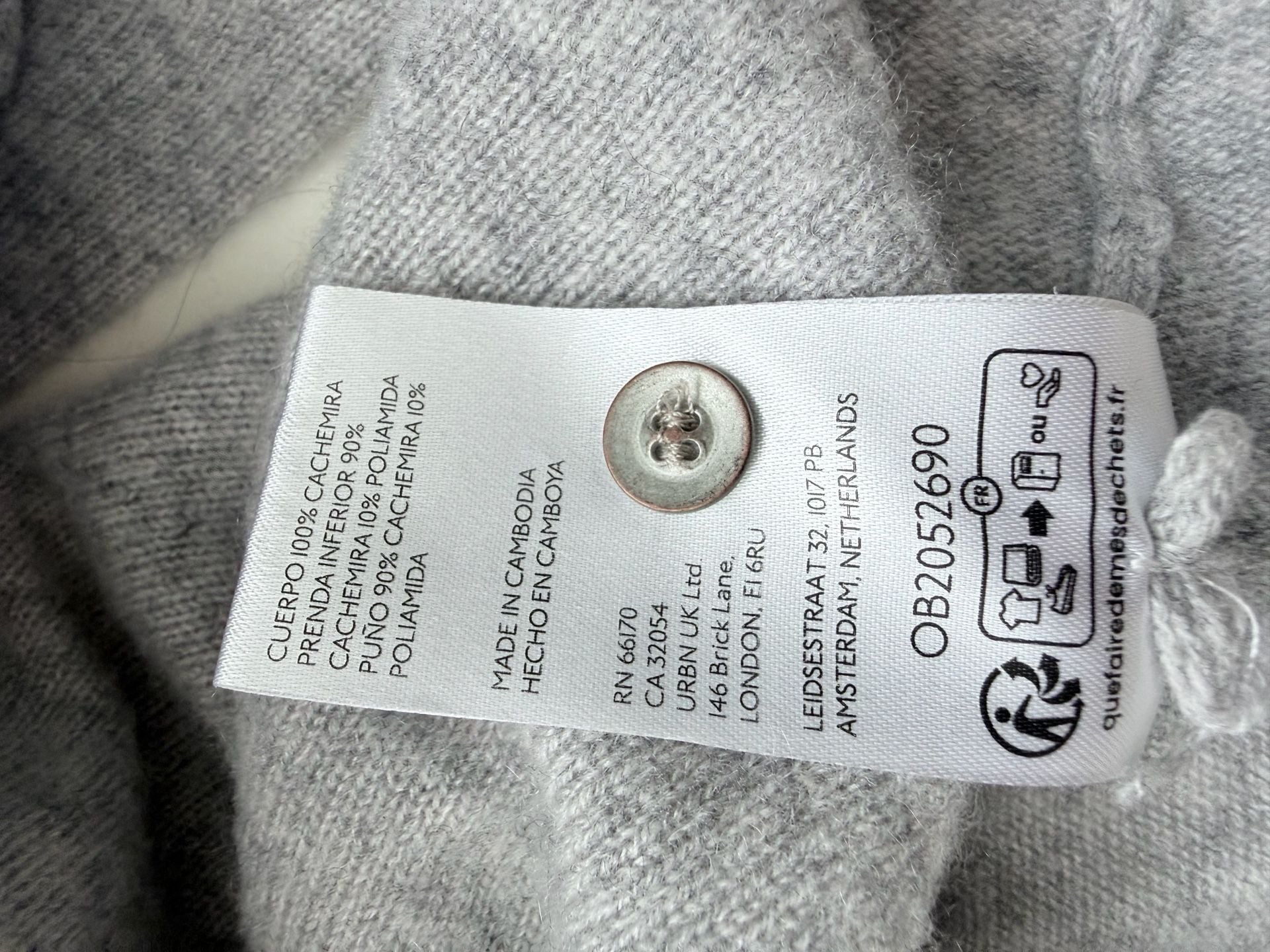 Pilcro 100% cashmere sweater in light grey. Long sleeves, button front with collar.  8