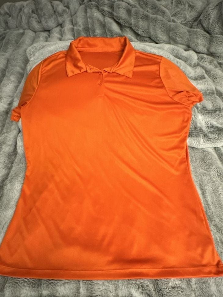 Animal Den Women's Moisture-Wicking Performance Sport Polo in Bright Orange 2
