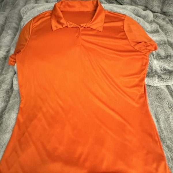 Animal Den Women's Moisture-Wicking Performance Sport Polo in Bright Orange