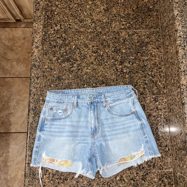 American Eagle Women's Light Wash Distressed Denim Cutoff Shorts with Sunflower Patchwork Detail, Size 2
