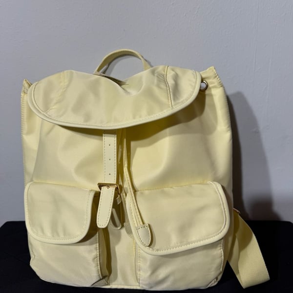Year of Ours Nylon Drawstring Lightweight Backpack in Butter Yellow