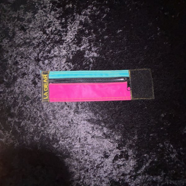 Vintage LA Gear retro neon zippered wrist wallet band.