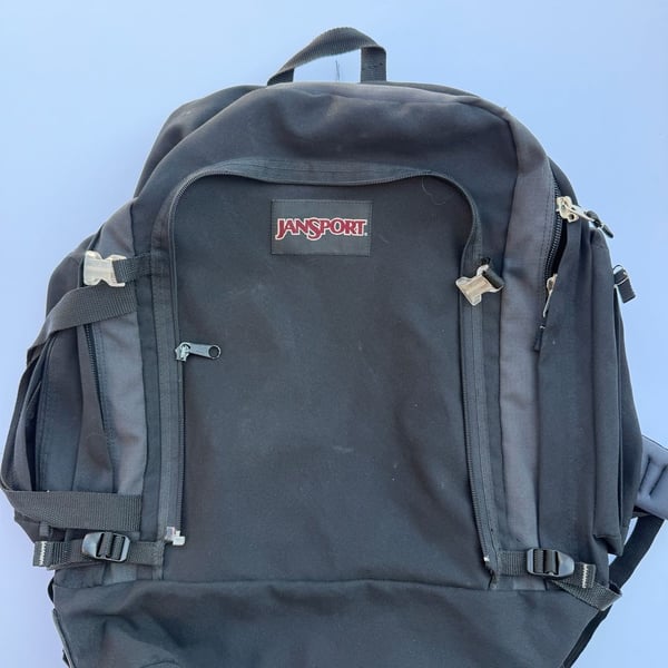 Vintage JanSport Black Backpack with Internal Frame and Multiple Compartments