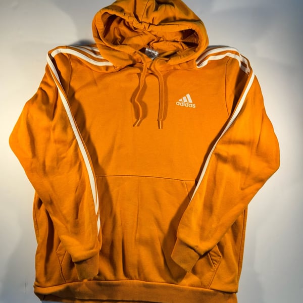 Orange Adidas hoodie with white stripes