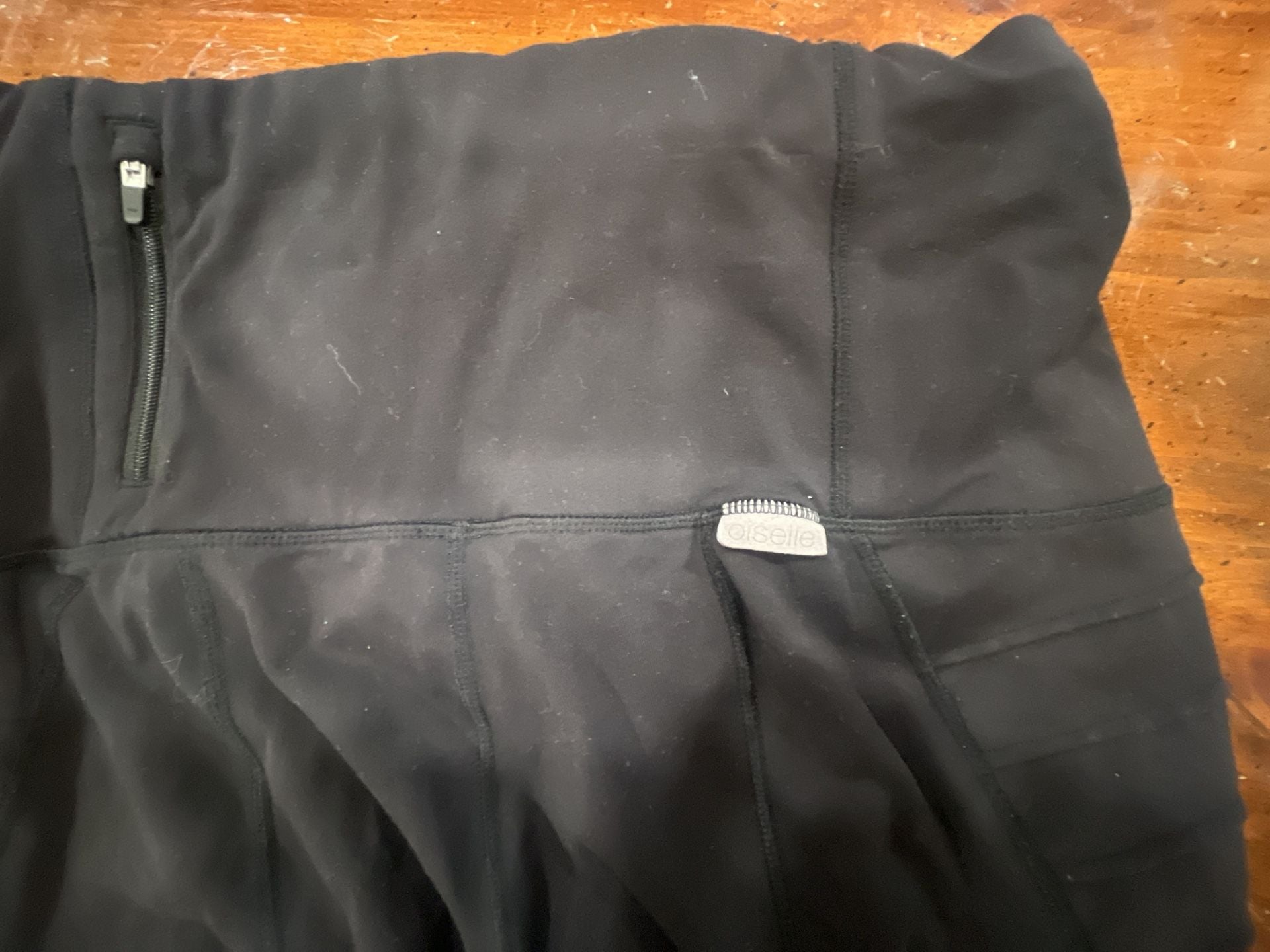 Oiselle Women's Black Leggings with Zip Waist Pocket and moto detailing 8