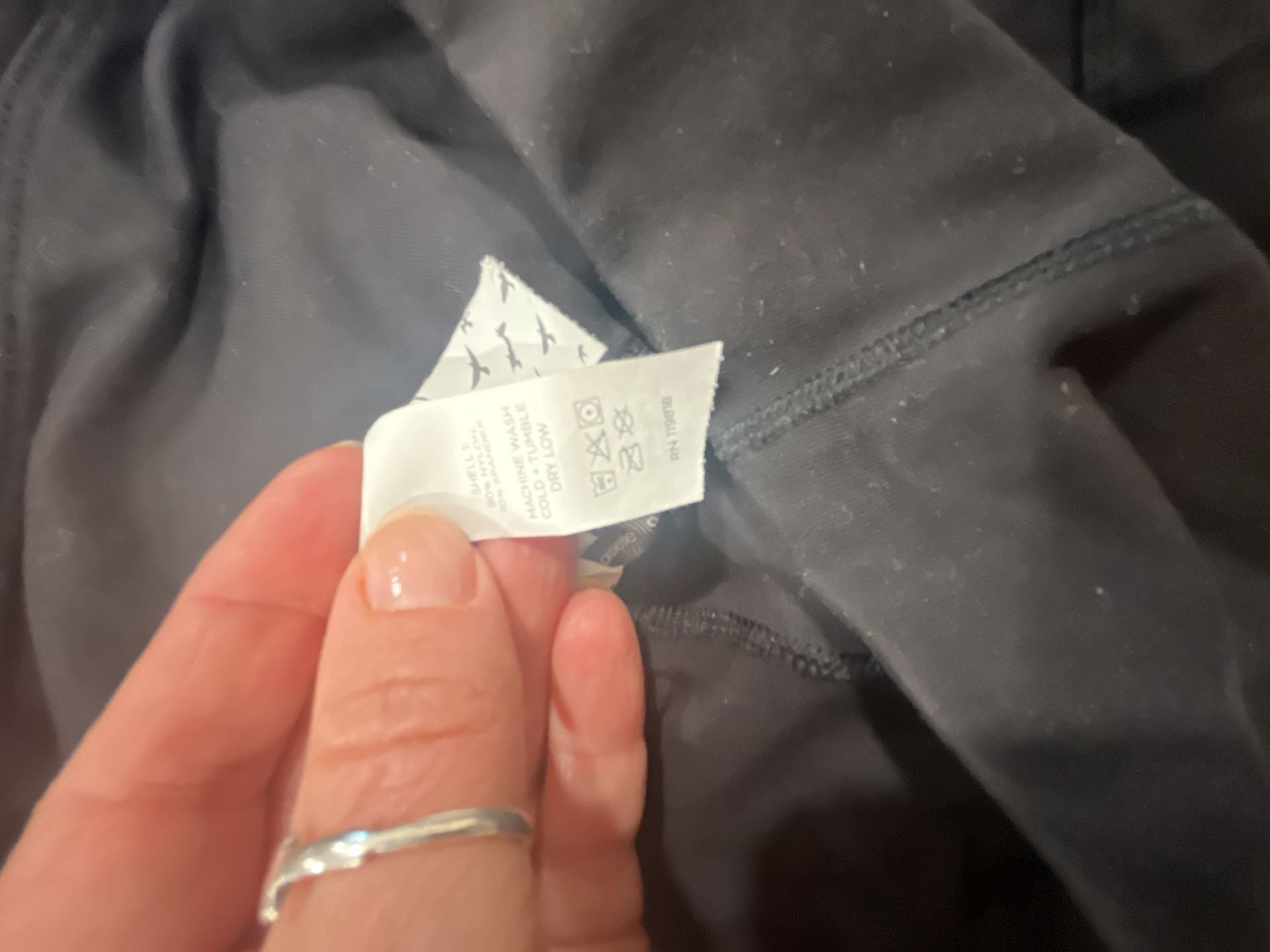 Oiselle Women's Black Leggings with Zip Waist Pocket and moto detailing 12