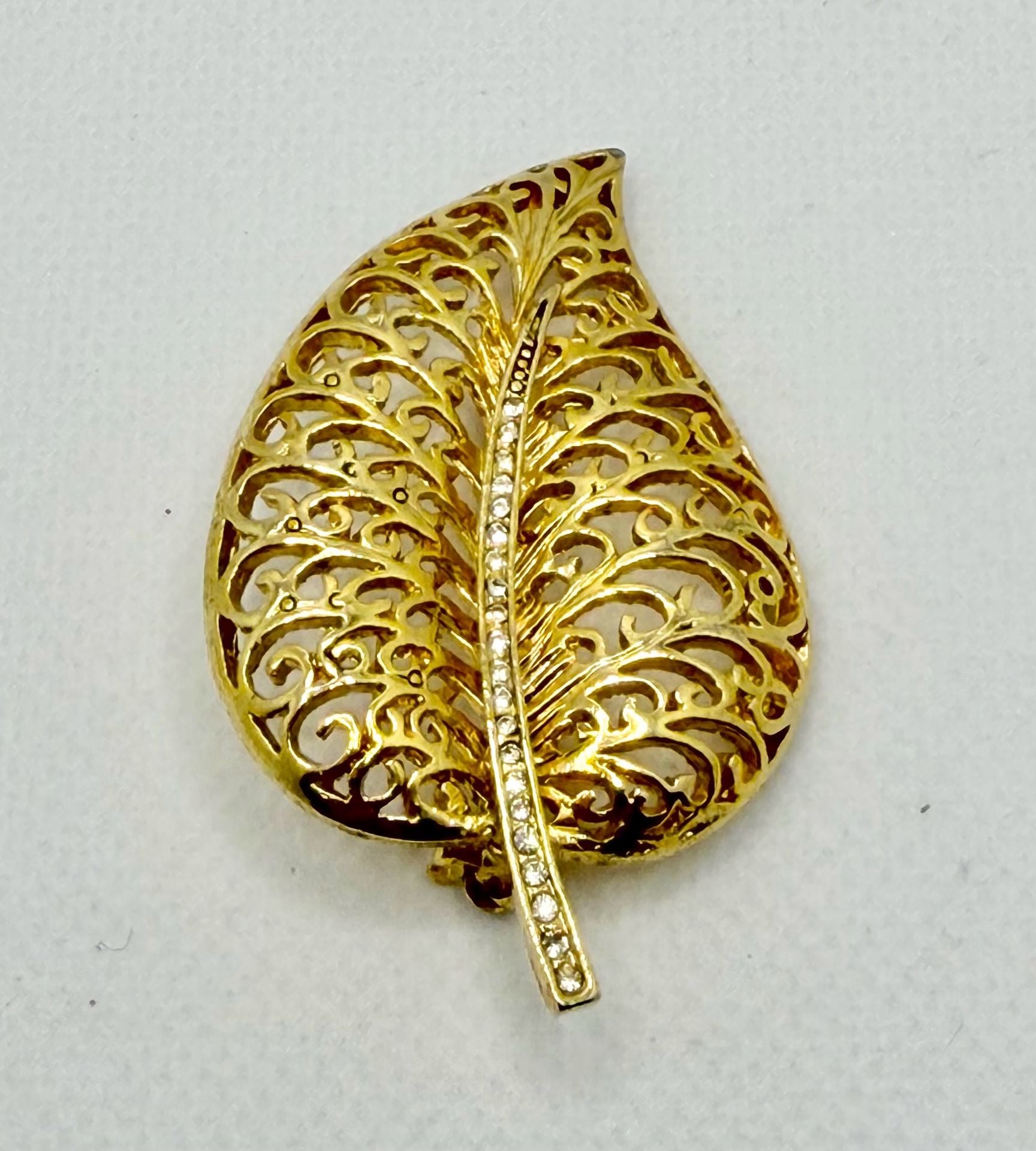 Vintage Gold Tone Metal Filigree Leaf Brooch with Rhinestone Stem 1