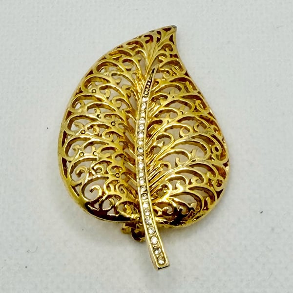 Vintage Gold Tone Metal Filigree Leaf Brooch with Rhinestone Stem