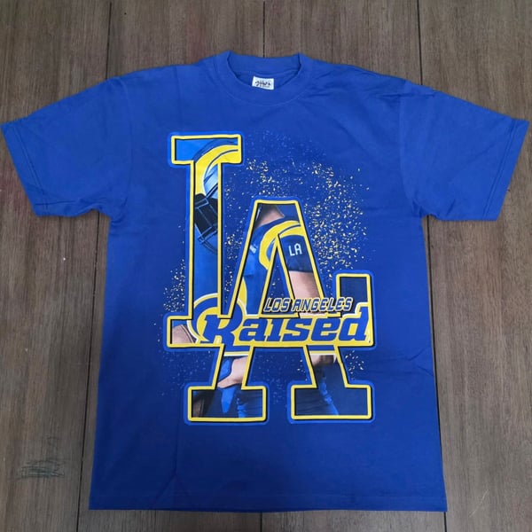Shaka Wear LA Raised Los Angeles Rams Short Sleeve Graphic T-Shirt Blue Men's Size Large