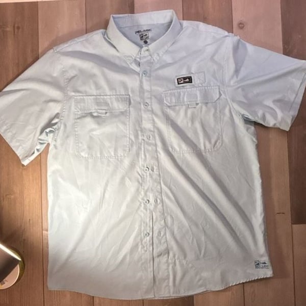 Pelagic Men's Light Blue Short Sleeve Button-Down Fishing Shirt with Dual Chest Pockets
