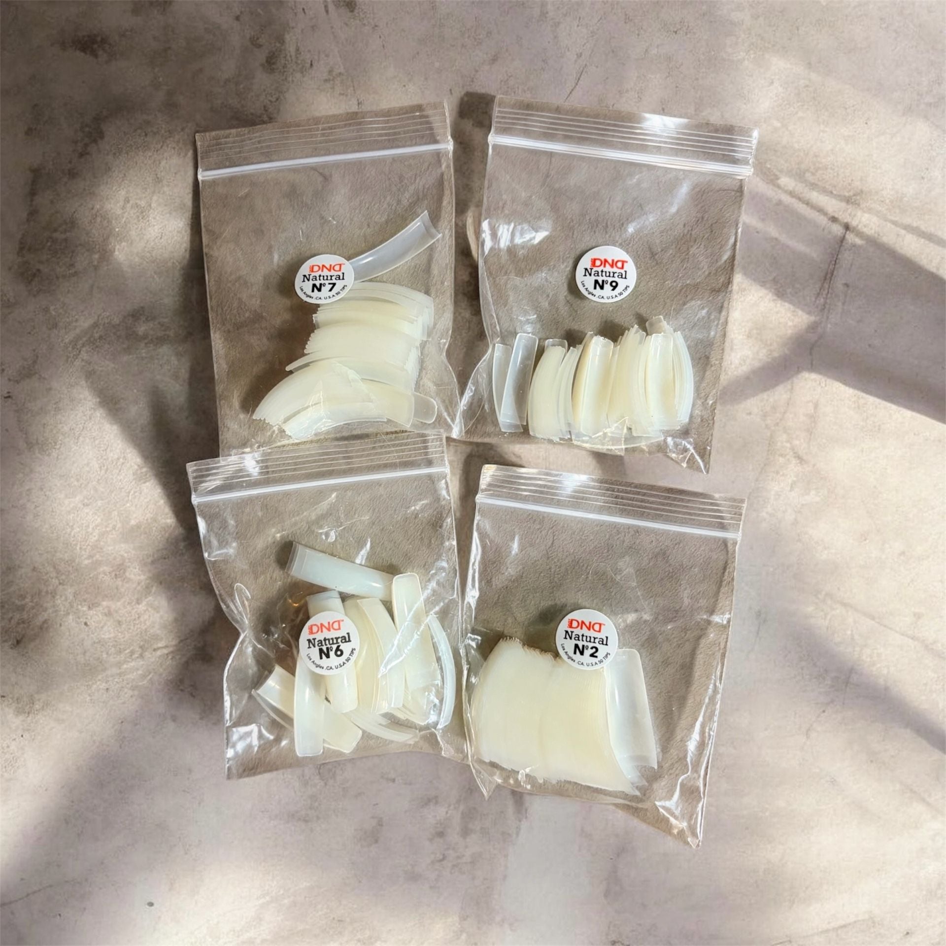DND Natural Nail Tips Assorted Sizes N2, N6, N7, N9 4-Pack 1