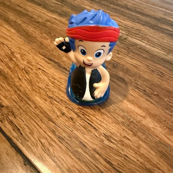 Fisher-Price Bubble Guppies Gil Rock and Roll Slider Figure