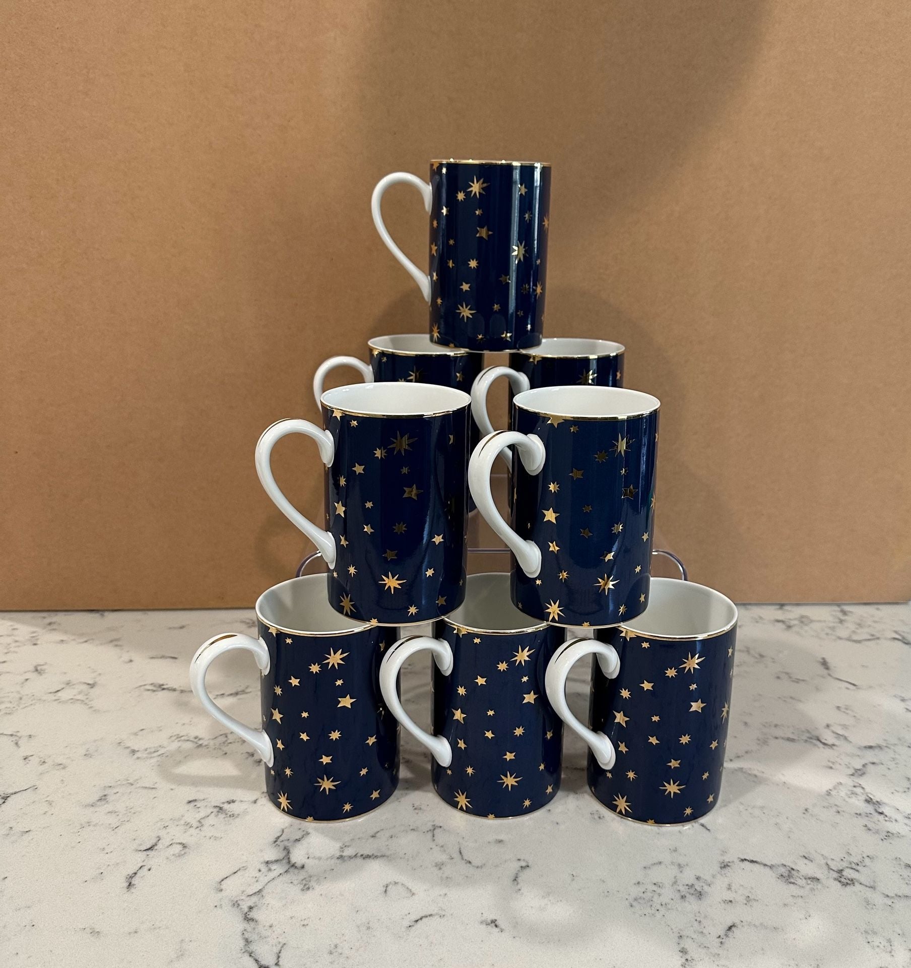 Pre owned, set of 8, Sakura Galaxy Blue porcelain coffee mugs featuring a navy blue celestial star pattern and 14K gold trim, Approximate Size: About 4 1/4 inches tall. Great condition, One of the cups has minimal sign of use, please refer to the photogra 1