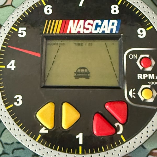 NASCAR electronic hand held racing game Techno Source 2005