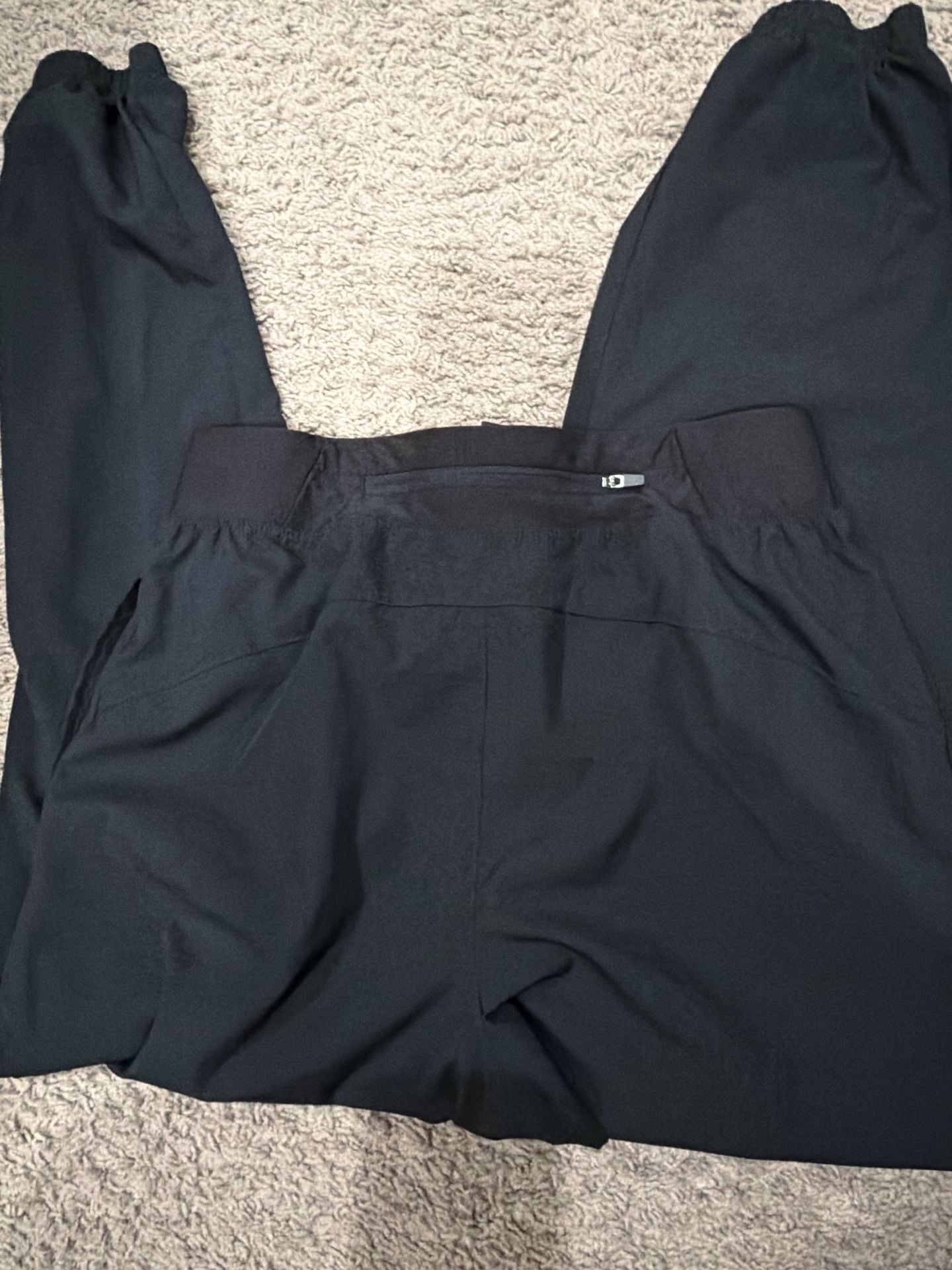 ASICS Pantalón de chándal Core Woven en Negro - 4