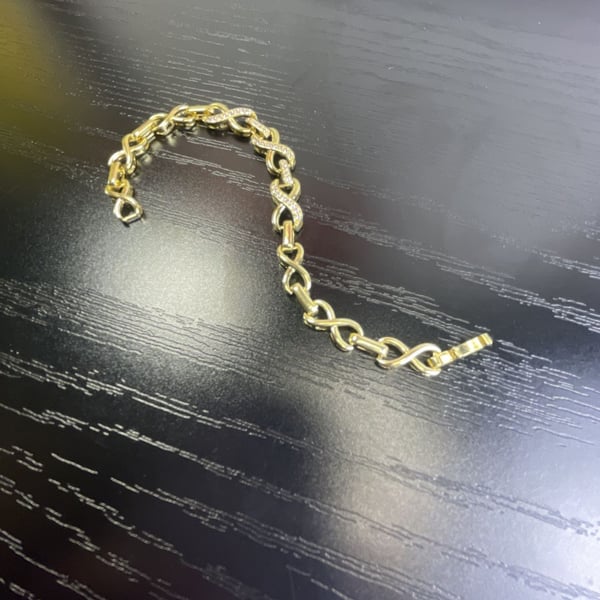 Gold Tone Infinity Link Bracelet with Rhinestone Crystal Accents