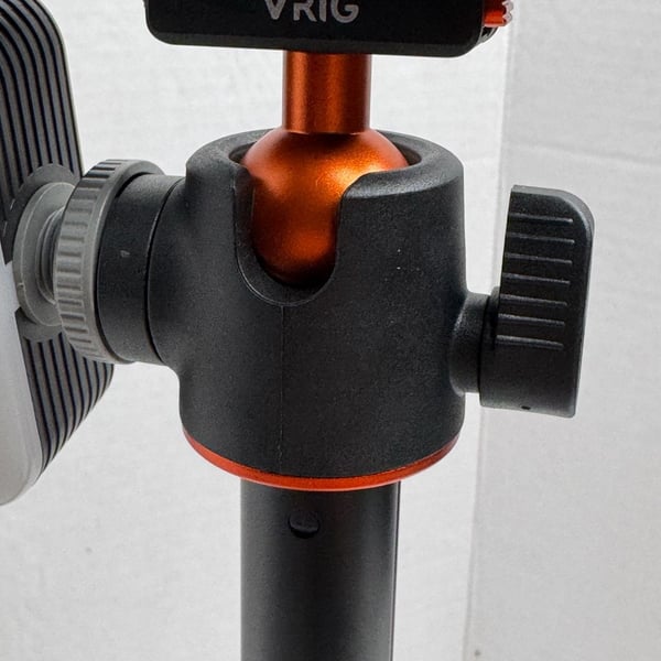VRIG Extendable Mini Tripod Selfie Stick with Ball Head does not come with light or camera just showing you what it would look like . 