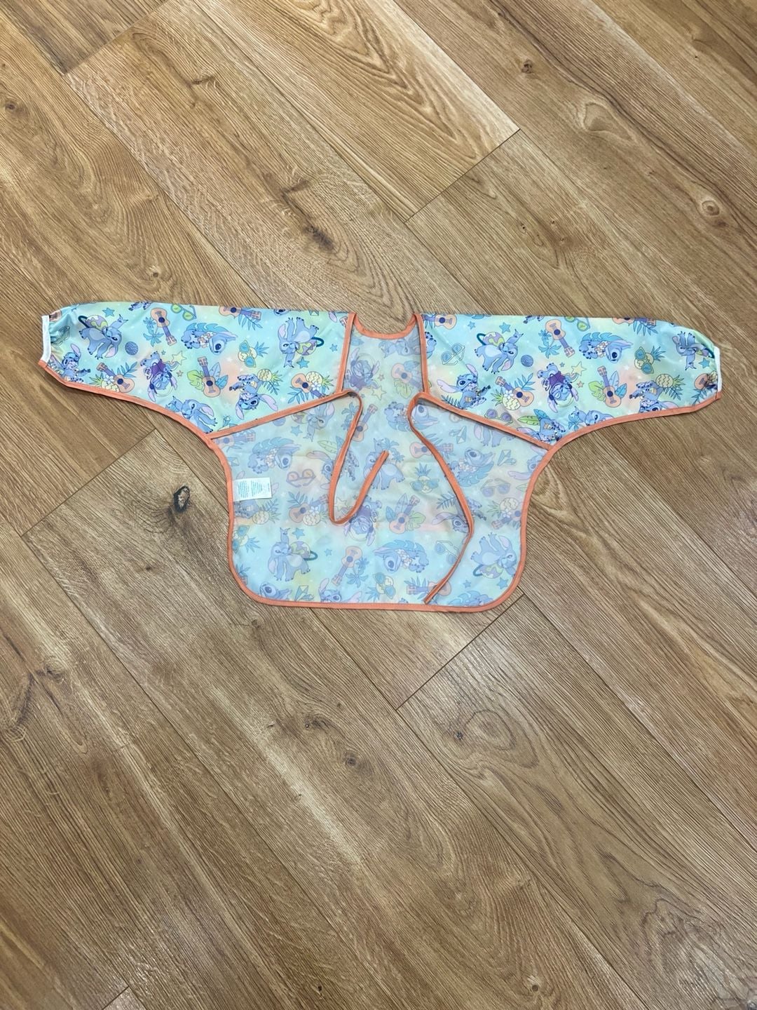Bumkins Disney Aloha Stitch Sleeved Bib Waterproof Pocketed Tie Back 2