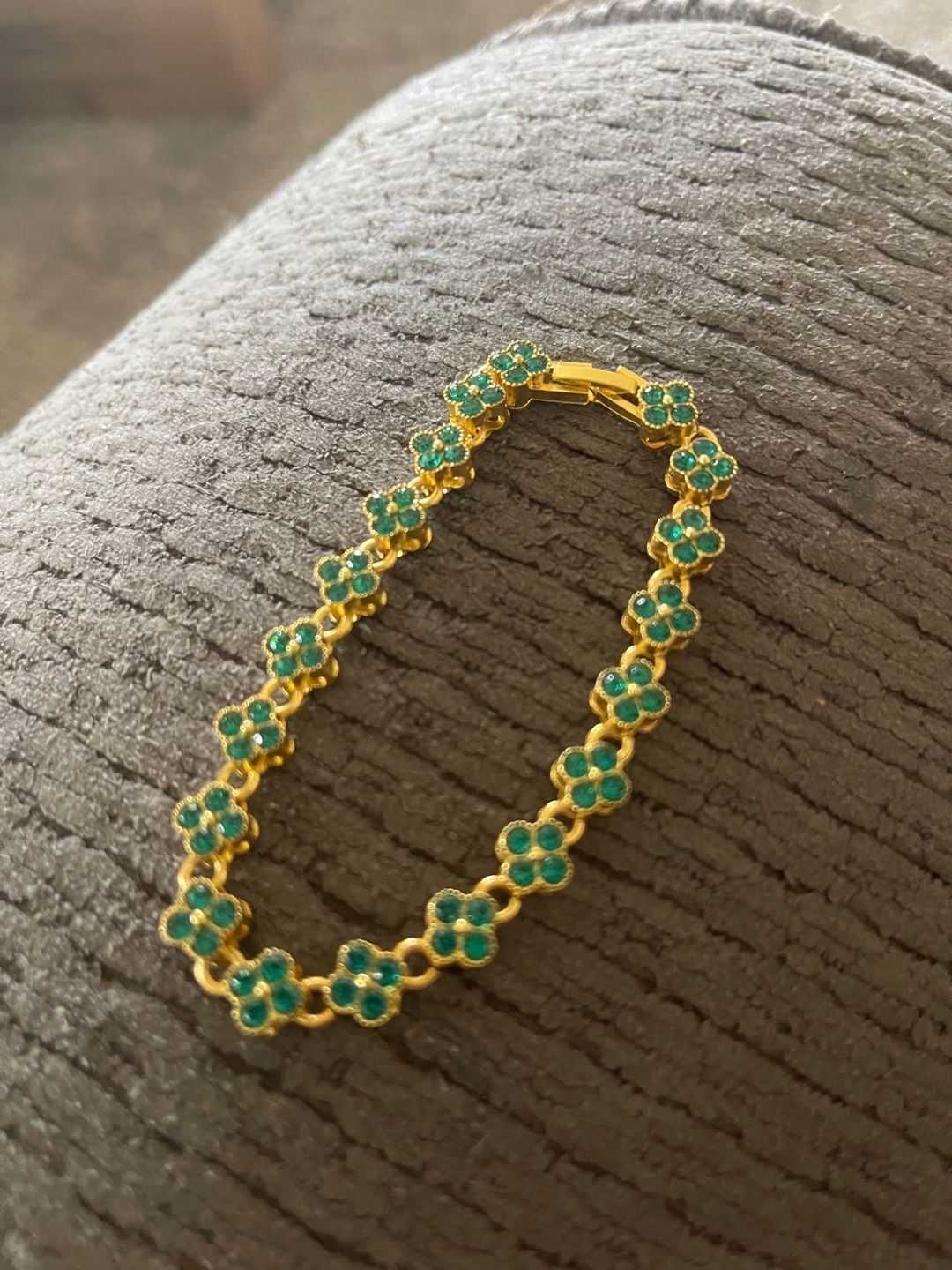 Gold tone tennis bracelet with four leaf clover shaped links. 2