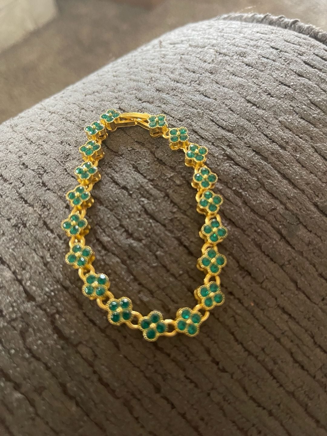 Gold tone tennis bracelet with four leaf clover shaped links. 3