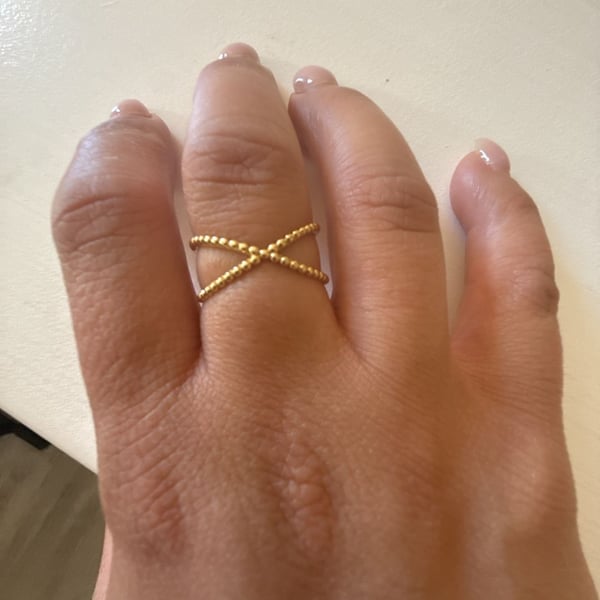 Unbranded Criss Cross Ring Size 9 Yellow Gold slid 18 K . Weight is 2.15 gramBeaded X Band