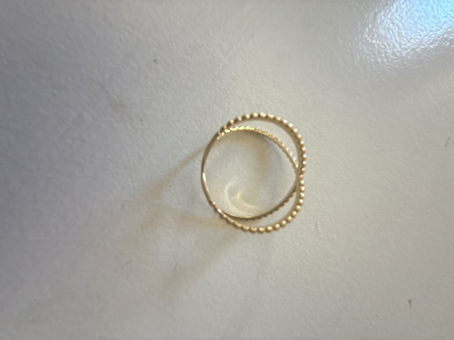 Unbranded Criss Cross Ring Size 9 Yellow Gold slid 18 K . Weight is 2.15 gramBeaded X Band 3