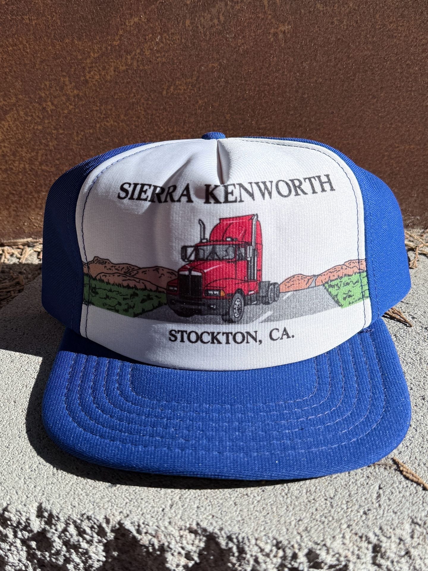 American Specialties Sierra Kenworth Trucker Snapback Hat Blue White 2